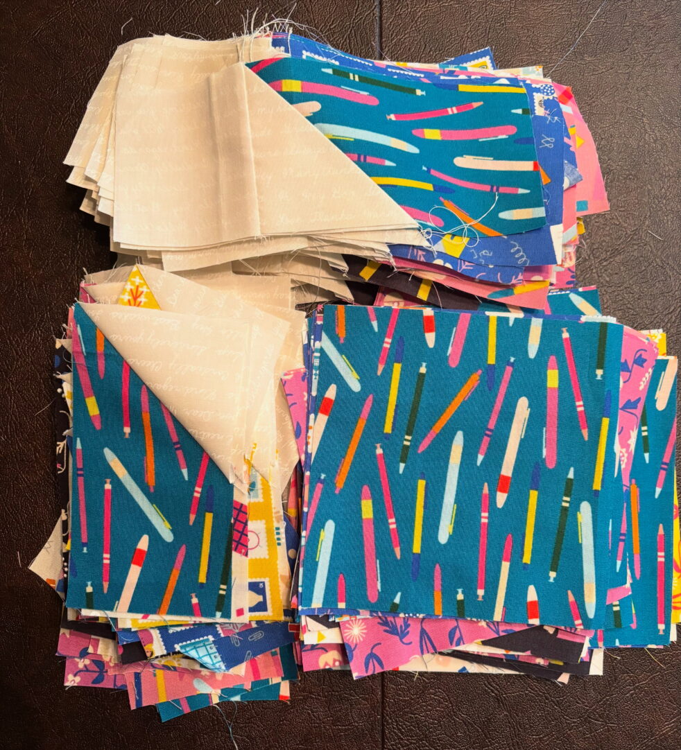 Brightly colored quilt blocks that come together to create a quarter of a star (in white fabric)